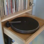 I build this out of an old turntable platter, VPI record cleaner nozzle, and a 1hp wet/dry shop vac!